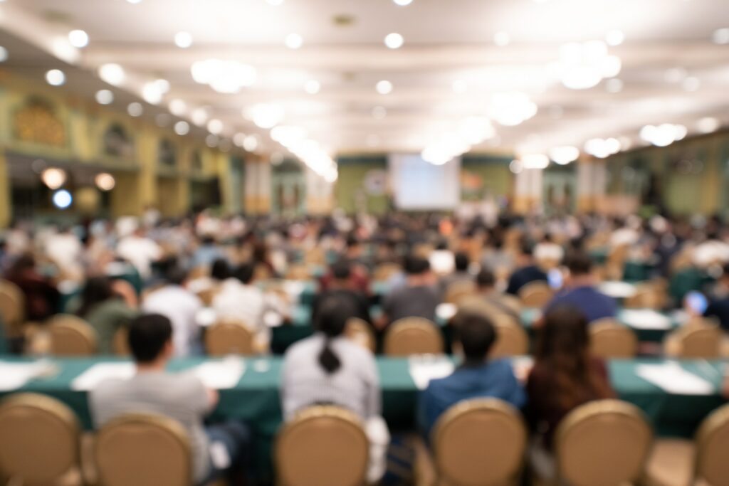 People sitting in rows at a conference