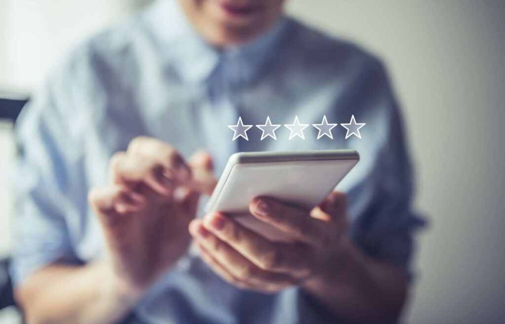 Person taking an Esurvey on a phone to generate star ratings