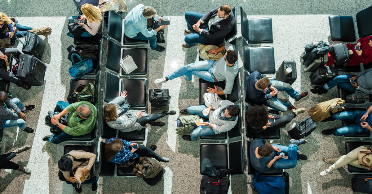 Overhead view of customers in airport waiting area