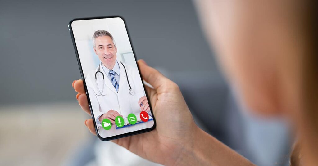 patient speaking with doctor on phone during telemedicine doctor appointment