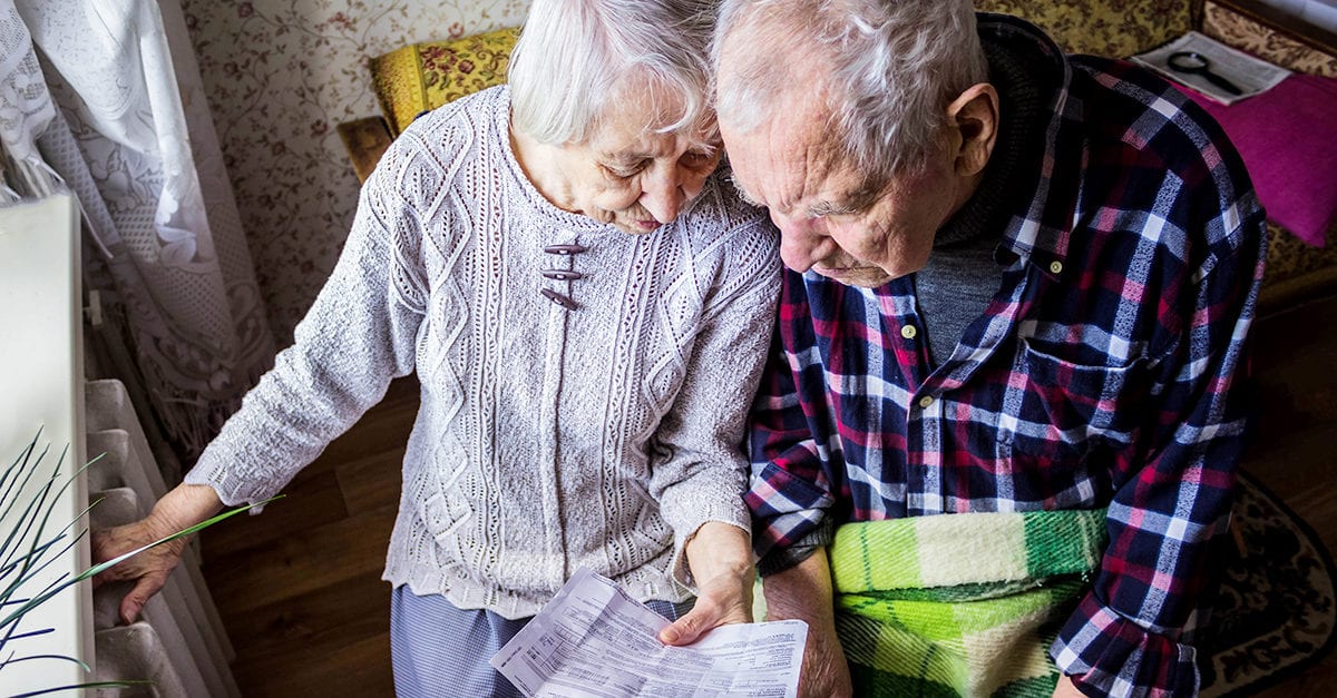 Elderly couple reviewing bill