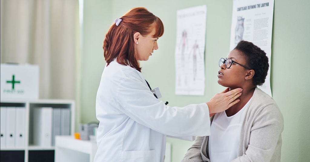 Doctor checking lymph nodes of a patient