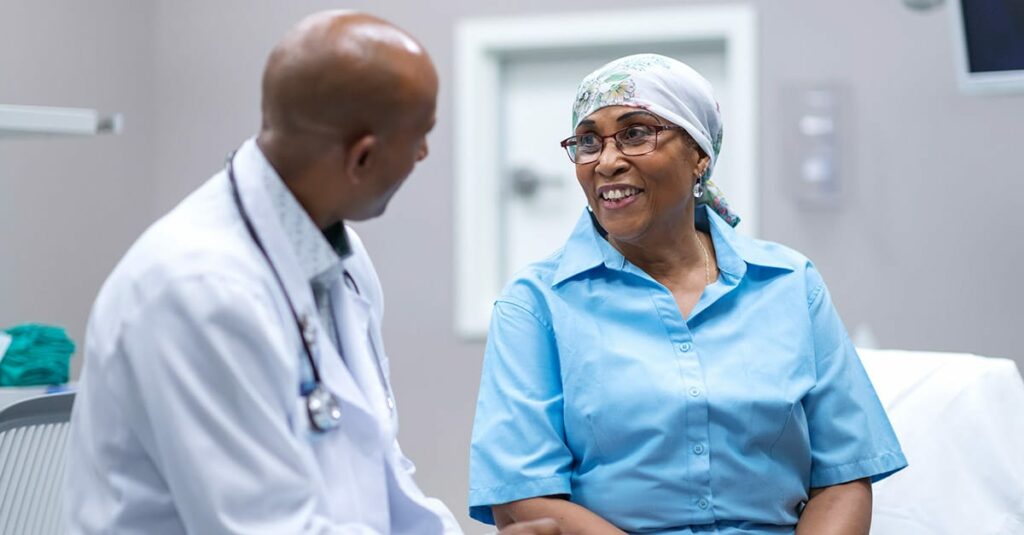 Doctor speaking to a cancer patient.